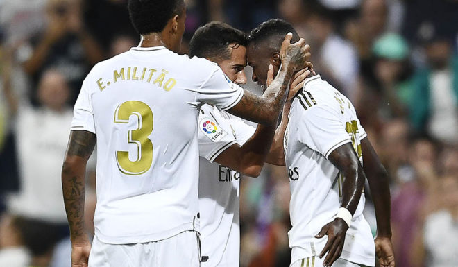 Real Madrid's Brazilian forward Vinicius Junior (R) celebrates his goal during the Spanish league football match between Real Madrid CF and CA Osasuna at the Santiago Bernabeu stadium in Madrid, on September 25, 2019. (Photo by OSCAR DEL POZO / AFP) (Photo credit should read OSCAR DEL POZO/AFP/Getty Images)