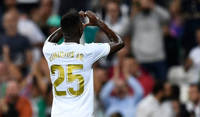 Vinícius Júnior Real Madrid's Brazilian forward Vinicius Junior celebrates his goal during the Spanish league football match between Real Madrid CF and CA Osasuna at the Santiago Bernabeu stadium in Madrid, on September 25, 2019. (Photo by OSCAR DEL POZO / AFP) (Photo credit should read OSCAR DEL POZO/AFP/Getty Images)