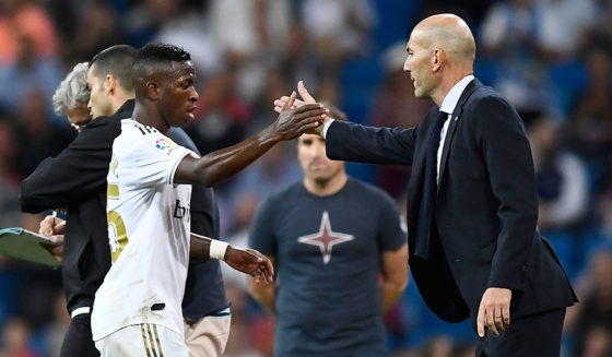Real Madrid's Brazilian forward Vinicius Junior (L) shakes hands with Real Madrid's French coach Zinedine Zidane as he leaves the pitch during the Spanish league football match between Real Madrid CF and CA Osasuna at the Santiago Bernabeu stadium in Madrid, on September 25, 2019. (Photo by OSCAR DEL POZO / AFP) (Photo credit should read OSCAR DEL POZO/AFP/Getty Images)