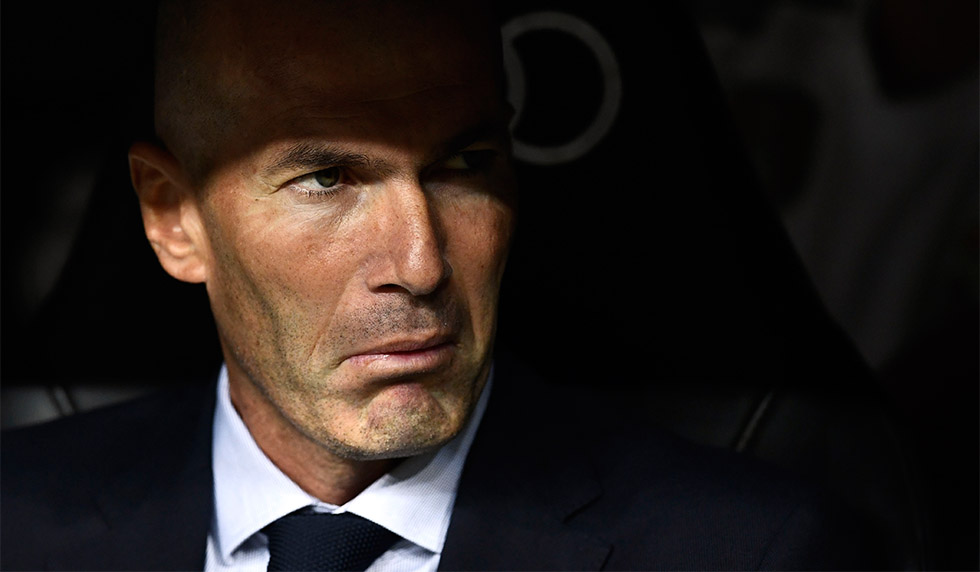 Real Madrid's French coach Zinedine Zidane sits on the bench before the Spanish league football match between Real Madrid CF and CA Osasuna at the Santiago Bernabeu stadium in Madrid, on September 25, 2019. (Photo by OSCAR DEL POZO / AFP) (Photo credit should read OSCAR DEL POZO/AFP/Getty Images)