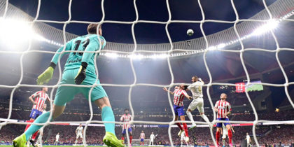 Real Madrid's French forward Karim Benzema (R) jumps for the ball with Atletico Madrid's Montenegrin defender Stefan Savic during the Spanish league football match between Club Atletico de Madrid and Real Madrid CF at the Wanda Metropolitano stadium in Madrid on September 28, 2019. (Photo by JAVIER SORIANO / AFP) (Photo credit should read JAVIER SORIANO/AFP/Getty Images)