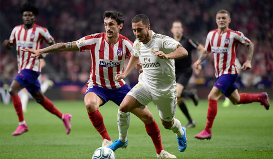 Atletico Madrid's Montenegrin defender Stefan Savic (L) vies with Real Madrid's Belgian forward Eden Hazard during the Spanish league football match between Club Atletico de Madrid and Real Madrid CF at the Wanda Metropolitano stadium in Madrid on September 28, 2019. (Photo by JAVIER SORIANO / AFP) (Photo credit should read JAVIER SORIANO/AFP/Getty Images)