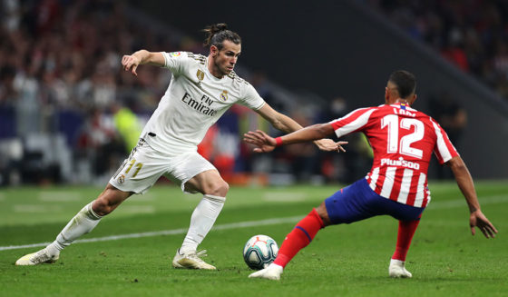 MADRID, SPAIN - SEPTEMBER 28: Gareth Bale of Real Madrid battles for the ball with Renan Lodi of Atletico Madrid during the Liga match between Club Atletico de Madrid and Real Madrid CF at Wanda Metropolitano on September 28, 2019 in Madrid, Spain. (Photo by Angel Martinez/Getty Images)