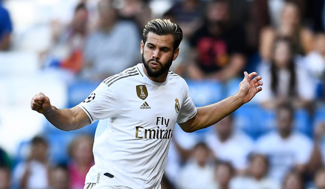 Real Madrid's Spanish defender Nacho Fernandez (R) challenges Club Brugge's Angolan defender Clinton Mata (L) during the UEFA Champions league Group A football match between Real Madrid and Club Brugge at the Santiago Bernabeu stadium in Madrid on October 1, 2019. (Photo by OSCAR DEL POZO / AFP) (Photo credit should read OSCAR DEL POZO/AFP/Getty Images)