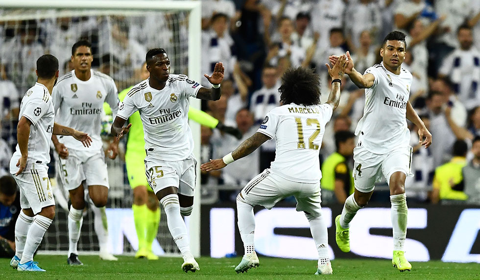 Real Madrid's Brazilian midfielder Casemiro (R) celebrates after scoring during the UEFA Champions league Group A football match between Real Madrid and Club Brugge at the Santiago Bernabeu stadium in Madrid on October 1, 2019. (Photo by OSCAR DEL POZO / AFP) (Photo credit should read OSCAR DEL POZO/AFP/Getty Images)