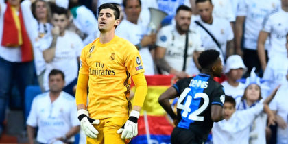 Real Madrid's Belgian goalkeeper Thibaut Courtois (L) reacts after Club Brugge's Nigerian forward Emmanuel Bonaventure scored a second goal during the UEFA Champions league Group A football match between Real Madrid and Club Brugge at the Santiago Bernabeu stadium in Madrid on October 1, 2019. (Photo by OSCAR DEL POZO / AFP) (Photo credit should read OSCAR DEL POZO/AFP/Getty Images)