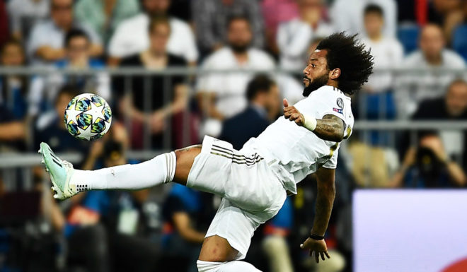 Real Madrid's Brazilian defender Marcelo kicks the ball during the UEFA Champions league Group A football match between Real Madrid and Club Brugge at the Santiago Bernabeu stadium in Madrid on October 1, 2019. (Photo by OSCAR DEL POZO / AFP) (Photo credit should read OSCAR DEL POZO/AFP/Getty Images)