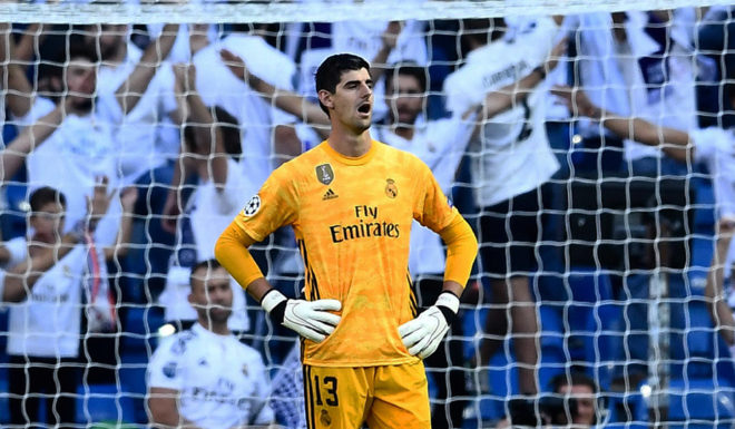 Real Madrid's Belgian goalkeeper Thibaut Courtois reacts during the UEFA Champions league Group A football match between Real Madrid and Club Brugge at the Santiago Bernabeu stadium in Madrid on October 1, 2019. (Photo by OSCAR DEL POZO / AFP) (Photo credit should read OSCAR DEL POZO/AFP/Getty Images)
