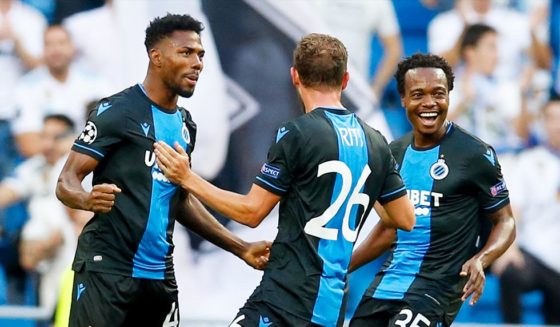 Emmanuel Dennis Club's Emmanuel Bonaventure Dennis celebrates after scoring the 0-1 goal with Club's Mats Rits and Club's Percy Tau during a game between Belgian soccer team Club Brugge and Spanish club Real Madrid on the second day (out of 6) in the group stage of the UEFA Champions League , Tuesday 01 October 2019 in Madrid, Spain. BELGA PHOTO BRUNO FAHY (Photo credit should read BRUNO FAHY/AFP/Getty Images)