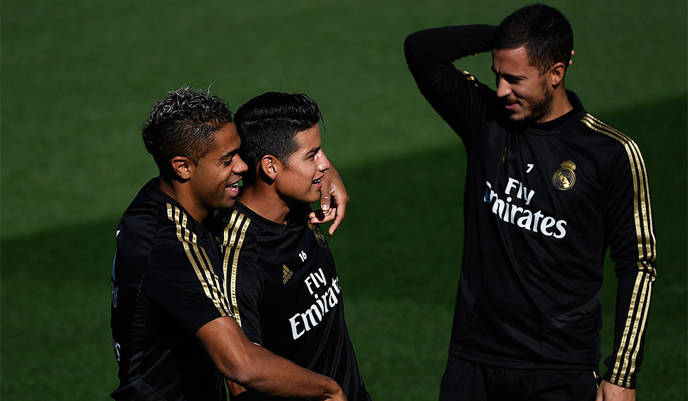 Real Madrid's Dominican forward Mariano Diaz (L), Real Madrid's Colombian midfielder James Rodriguez (C) and Real Madrid's Belgian forward Eden Hazard (R) attend a training session at Valdebebas Sport City in Madrid on October 4, 2019 on the eve of a Liga football match against Granada. (Photo by PIERRE-PHILIPPE MARCOU / AFP) (Photo by PIERRE-PHILIPPE MARCOU/AFP via Getty Images)