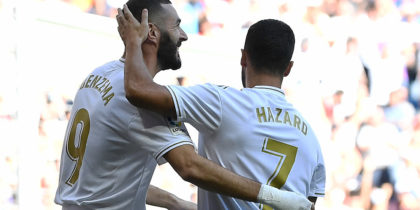 Real Madrid's French forward Karim Benzema (L) celebrates scoring the opening goal with Real Madrid's Belgian forward Eden Hazard during the Spanish league football match between Real Madrid CF and Granada FC at the Santiago Bernabeu stadium in Madrid on October 5, 2019. (Photo by PIERRE-PHILIPPE MARCOU / AFP) (Photo by PIERRE-PHILIPPE MARCOU/AFP via Getty Images)