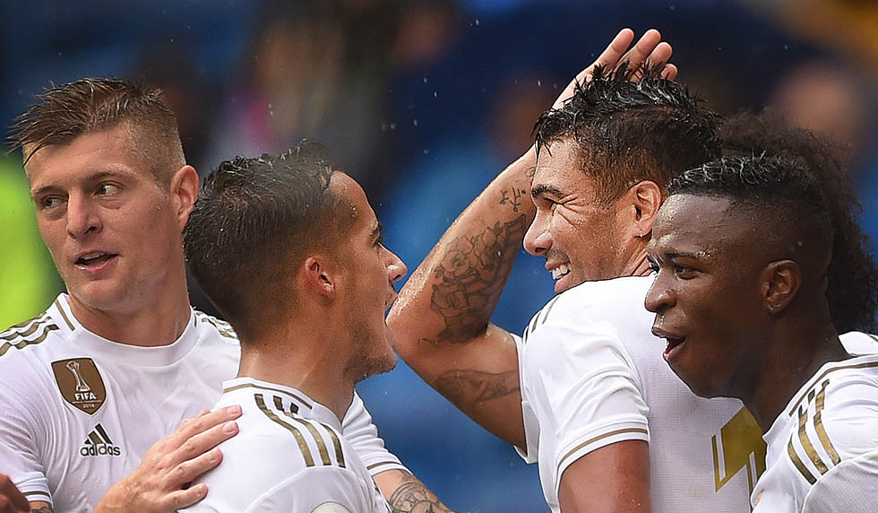 MADRID, SPAIN - SEPTEMBER 14: Henrique Casemiro of Real Madrid celebrates with Toni Kroos, Lucas Vazquez and Vinicius Junior after scoring his team's third goal during the La Liga match between Real Madrid CF and Levante UD at Estadio Santiago Bernabeu on September 14, 2019 in Madrid, Spain. (Photo by Denis Doyle/Getty Images)