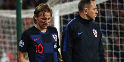 Croatia's midfielder Luka Modric (C) is helped from the pitch after picking up an injury during the Euro 2020 football qualification match between Wales and Croatia at Cardiff City Stadium, Cardiff on October 13, 2019. (Photo by GEOFF CADDICK / AFP) (Photo by GEOFF CADDICK/AFP via Getty Images)