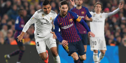 Barcelona's Argentinian forward Lionel Messi (C) vies for the ball with Real Madrid's Brazilian midfielder Casemiro during the Spanish Copa del Rey (King's Cup) semi-final first leg football match between FC Barcelona and Real Madrid CF at the Camp Nou stadium in Barcelona on February 6, 2019. (Photo by LLUIS GENE / AFP) (Photo credit should read LLUIS GENE/AFP/Getty Images)