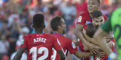 Granada's Spanish midfielder Antonio Puertas (Top) celebrates with Spanish forward Roberto Soldado after scoring during the Spanish league football match between Granada FC and Club Deportivo Leganes SAD at Nuevo Los Carmenes stadium in Granada on September 28, 2019. (Photo by JORGE GUERRERO / AFP) (Photo credit should read JORGE GUERRERO/AFP/Getty Images)