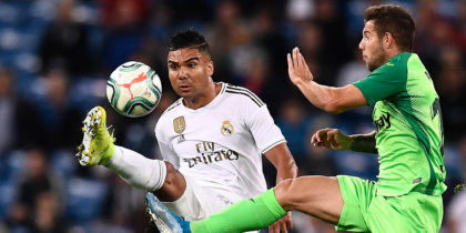 Real Madrid's Brazilian midfielder Casemiro (L) vies with Leganes' Spanish forward Aitor Ruibal during the Spanish league football match between Real Madrid CF and Club Deportivo Leganes SAD at the Santiago Bernabeu stadium in Madrid on October 30, 2019. (Photo by OSCAR DEL POZO / AFP) (Photo by OSCAR DEL POZO/AFP via Getty Images)