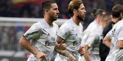 Real Madrid's Belgian forward Eden Hazard (L) and Real Madrid's Spanish defender Sergio Ramos (C) warm up before the Spanish league football match between Club Atletico de Madrid and Real Madrid CF at the Wanda Metropolitano stadium in Madrid on September 28, 2019. (Photo by JAVIER SORIANO / AFP) (Photo credit should read JAVIER SORIANO/AFP via Getty Images)