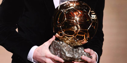 TOPSHOT - Barcelona's Argentinian forward Lionel Messi reacts after winning the Ballon d'Or France Football 2019 trophy at the Chatelet Theatre in Paris on December 2, 2019. - Lionel Messi won a record-breaking sixth Ballon d'Or on Monday after another sublime year for the Argentinian, whose familiar brilliance remained undimmed even through difficult times for club and country. (Photo by FRANCK FIFE / AFP) (Photo by FRANCK FIFE/AFP via Getty Images)