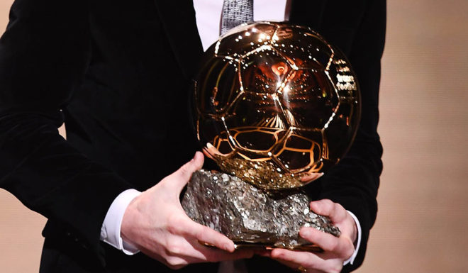 TOPSHOT - Barcelona's Argentinian forward Lionel Messi reacts after winning the Ballon d'Or France Football 2019 trophy at the Chatelet Theatre in Paris on December 2, 2019. - Lionel Messi won a record-breaking sixth Ballon d'Or on Monday after another sublime year for the Argentinian, whose familiar brilliance remained undimmed even through difficult times for club and country. (Photo by FRANCK FIFE / AFP) (Photo by FRANCK FIFE/AFP via Getty Images)