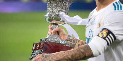 MADRID, SPAIN - AUGUST 16: Sergio Ramos of Real Madrid CF celebrates with the Supercopa de Espana trophy after beating FC Barcelona 2-0 (3-1) on aggregate in the Supercopa de Espana Final 2nd Leg match between Real Madrid and FC Barcelona at Estadio Santiago Bernabeu on August 16, 2017 in Madrid, Spain. (Photo by Denis Doyle/Getty Images)
