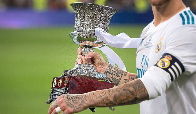 Supercopa MADRID, SPAIN - AUGUST 16: Sergio Ramos of Real Madrid CF celebrates with the Supercopa de Espana trophy after beating FC Barcelona 2-0 (3-1) on aggregate in the Supercopa de Espana Final 2nd Leg match between Real Madrid and FC Barcelona at Estadio Santiago Bernabeu on August 16, 2017 in Madrid, Spain. (Photo by Denis Doyle/Getty Images)