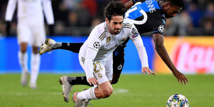 Club Brugge's Nigerian forward Dennis Emmanuel Bonaventure (R) and Real Madrid's Spanish midfielder Isco fall during the UEFA Champions League Group A football match between Club Brugge and Real Madrid CF at the Jan Breydel Stadium in Bruges on December 11, 2019. (Photo by JOHN THYS / AFP) (Photo by JOHN THYS/AFP via Getty Images)