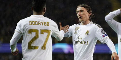 Real Madrid's Brazilian forward Rodrygo (L) celebrates with Real Madrid's Croatian midfielder Luka Modric (C) and Real Madrid's Spanish defender Alvaro Odriozola after scoring the opener during the UEFA Champions League Group A football match between Club Brugge and Real Madrid CF at the Jan Breydel Stadium in Bruges on December 11, 2019. (Photo by KENZO TRIBOUILLARD / AFP) (Photo by KENZO TRIBOUILLARD/AFP via Getty Images)