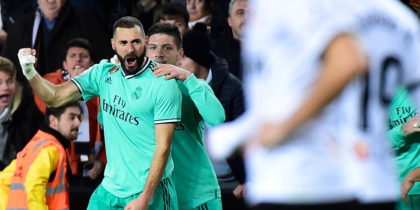 Real Madrid's French forward Karim Benzema celebrates after scoring a goal during the Spanish League football match between Valencia CF and Real Madrid, at the Mestalla stadium in Valencia, on December 15, 2019. (Photo by JOSE JORDAN / AFP) (Photo by JOSE JORDAN/AFP via Getty Images)
