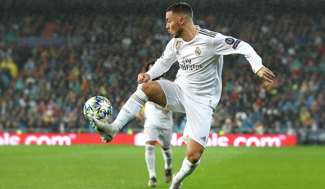 Eden Hazard MADRID, SPAIN - NOVEMBER 26: Eden Hazard of Real Madrid runs with the ball during the UEFA Champions League group A match between Real Madrid and Paris Saint-Germain at Bernabeu on November 26, 2019 in Madrid, Spain. (Photo by Angel Martinez/Getty Images)
