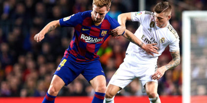 BARCELONA, SPAIN - DECEMBER 18: Ivan Rakitic of Barcelona holds off Toni Kroos of Real Madrid during the Liga match between FC Barcelona and Real Madrid CF at Camp Nou on December 18, 2019 in Barcelona, Spain. (Photo by Alex Caparros/Getty Images)