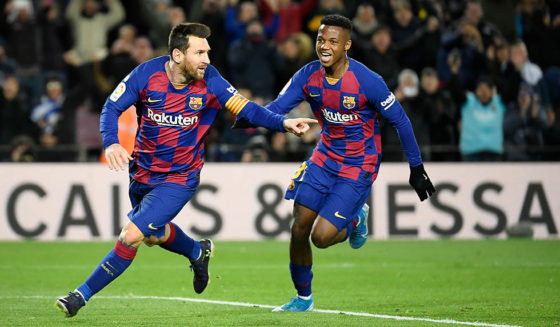 Barcelona's Argentine forward Lionel Messi (L) celebrates after scoring the opening goal during the Spanish league football match between FC Barcelona and Granada FC at the Camp Nou stadium in Barcelona on January 19, 2020. (Photo by LLUIS GENE / AFP) (Photo by LLUIS GENE/AFP via Getty Images)