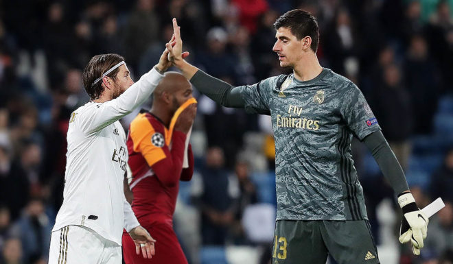 MADRID, SPAIN - NOVEMBER 06: Marcao of Galatasaray reacts as Sergio Ramos and Thibaut Courtois of Real Madrid celebrate after the UEFA Champions League group A match between Real Madrid and Galatasaray at Bernabeu on November 06, 2019 in Madrid, Spain. (Photo by Gonzalo Arroyo Moreno/Getty Images)