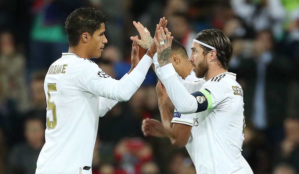 MADRID, SPAIN - NOVEMBER 06: Sergio Ramos of Real Madrid celebrates with teammate Raphael Varane after scoring his team's third goal during the UEFA Champions League group A match between Real Madrid and Galatasaray at Bernabeu on November 06, 2019 in Madrid, Spain. (Photo by Angel Martinez/Getty Images)