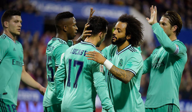 Real Madrid Real Madrid's Spanish forward Lucas Vazquez (C) celebrates with teammates after scoring during the Copa del Rey (King's Cup) football match between Zaragoza and Real Madrid CF at La Romareda stadium in Zaragoza, on January 29, 2020. (Photo by JOSE JORDAN / AFP) (Photo by JOSE JORDAN/AFP via Getty Images)