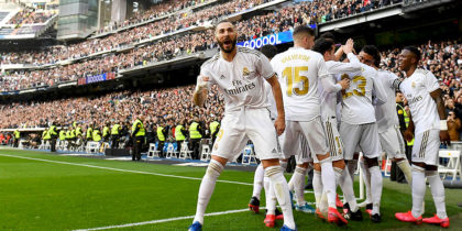 Real Madrid's French forward Karim Benzema (L) celebrates after scoring a goal during the Spanish league football match between Real Madrid CF and Club Atletico de Madrid at the Santiago Bernabeu stadium in Madrid on February 1, 2020. (Photo by PIERRE-PHILIPPE MARCOU / AFP) (Photo by PIERRE-PHILIPPE MARCOU/AFP via Getty Images)