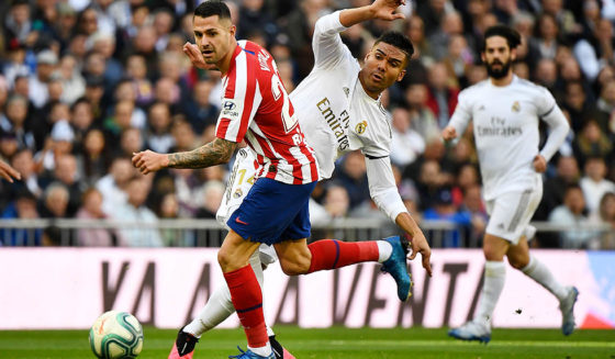 Vitolo, Casemiro, Isco Atletico Madrid's Spanish midfielder Vitolo (L) vies with Real Madrid's Brazilian midfielder Casemiro during the Spanish league football match between Real Madrid CF and Club Atletico de Madrid at the Santiago Bernabeu stadium in Madrid on February 1, 2020. (Photo by PIERRE-PHILIPPE MARCOU / AFP) (Photo by PIERRE-PHILIPPE MARCOU/AFP via Getty Images)